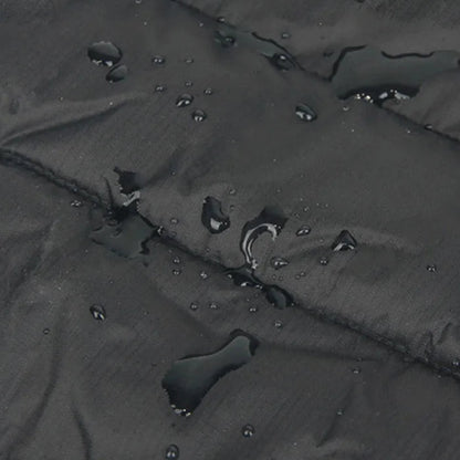 Water repellent material with text about fabric composition on a black surface